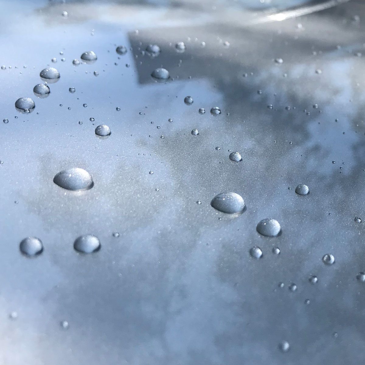 Water beads on waxed car