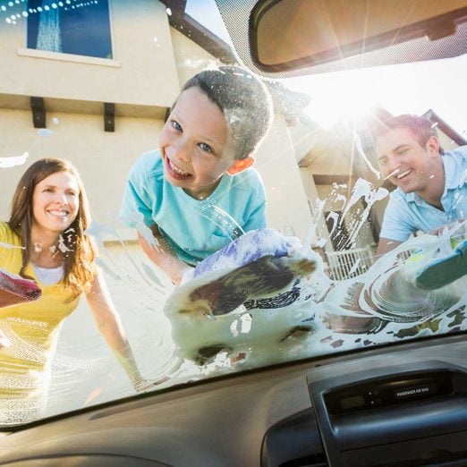 Family washing a car