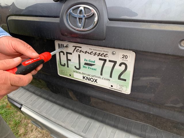 Cleaning a license plate