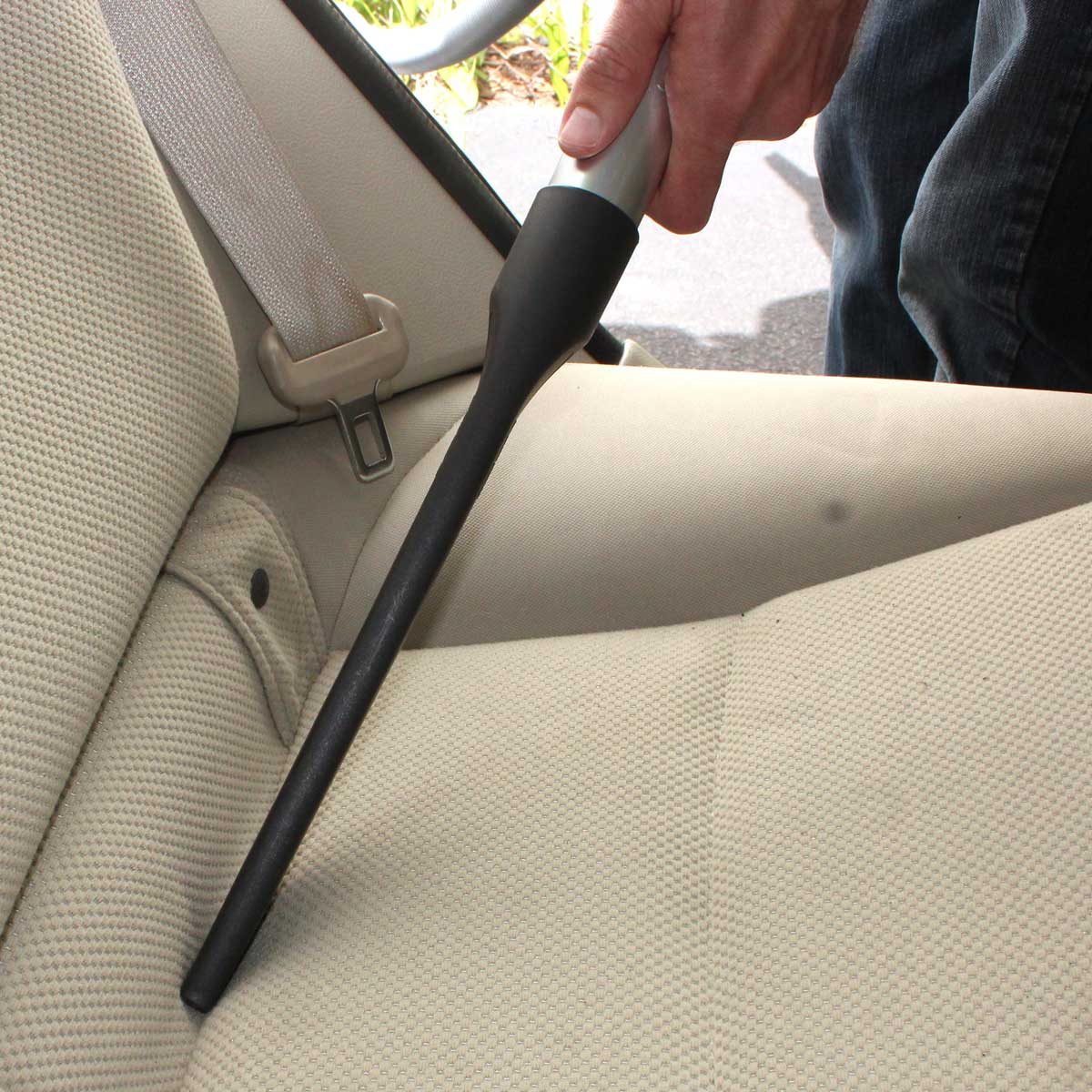 Vacuuming a cloth car seat