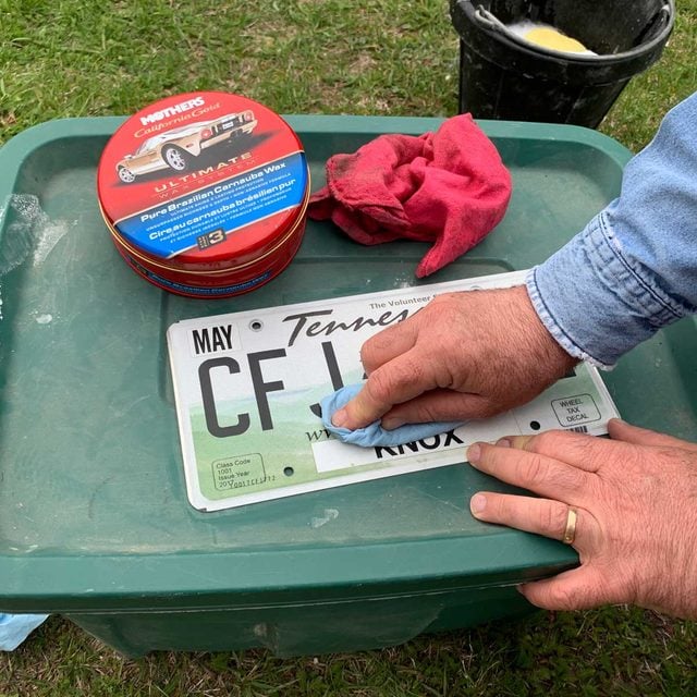 Cleaning a license plate