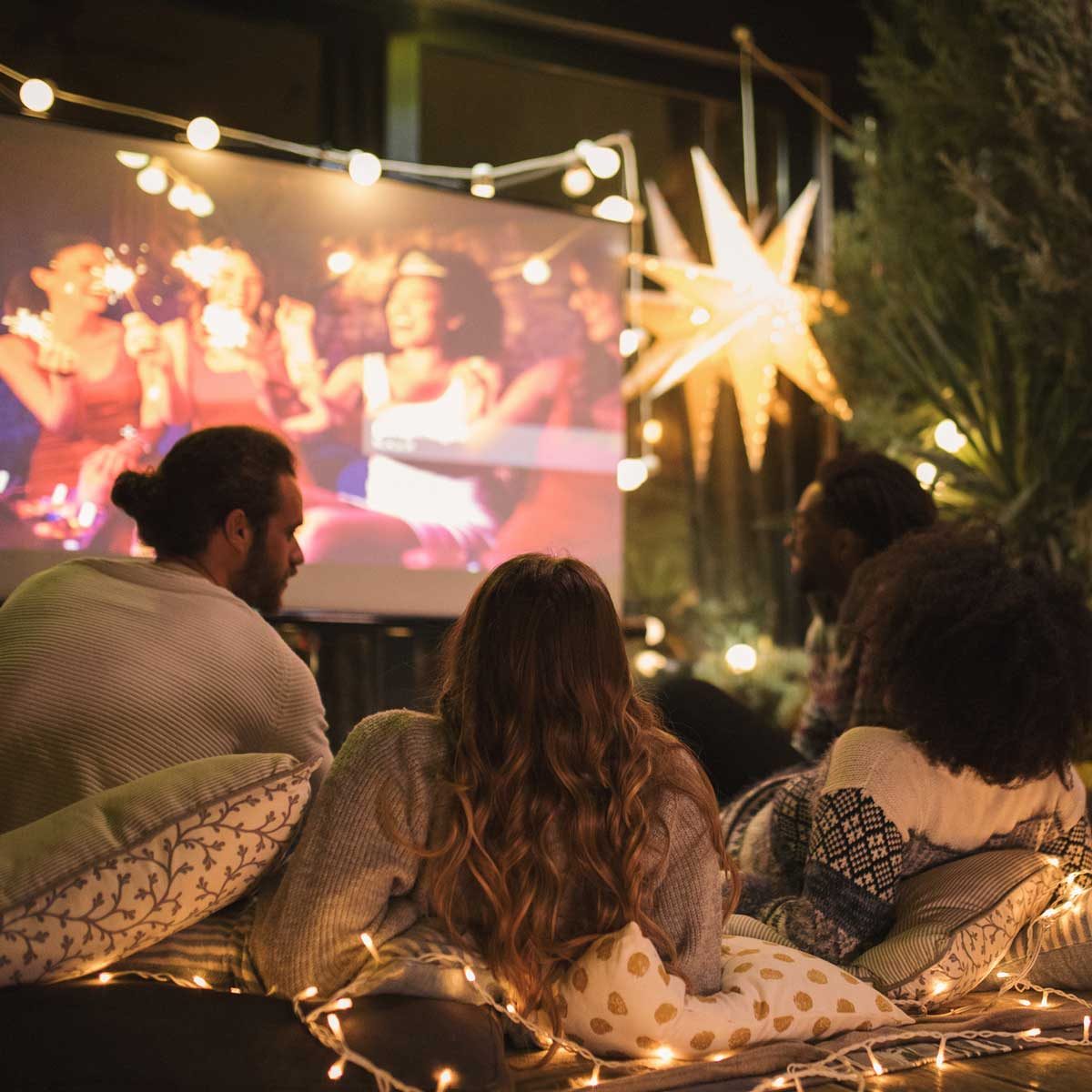 Outdoor projector with four people