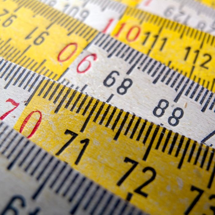 wooden white and yellow ruler metric system