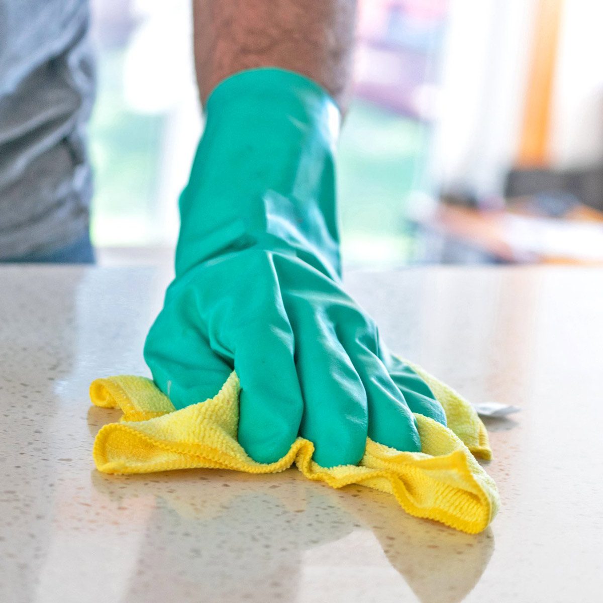 cleaner a-hand-wiping-table-surfaces