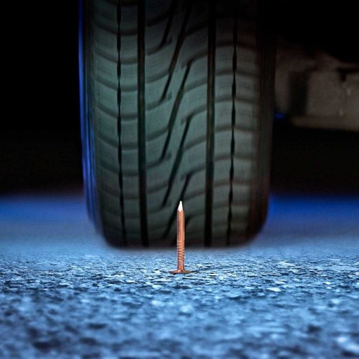 Nail in front of a tire