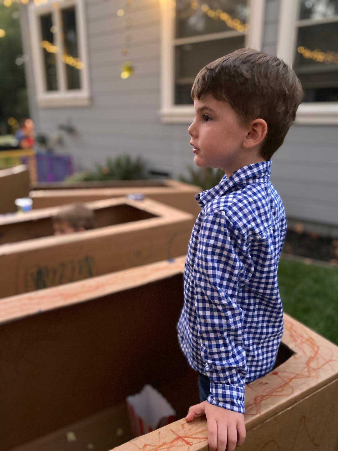 Child standing in a box