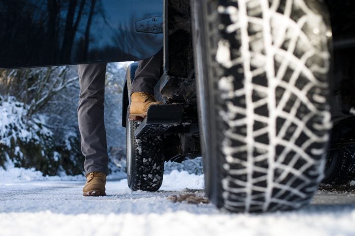 Ground View Of A Jeep Tyre On A Snow Covered Road