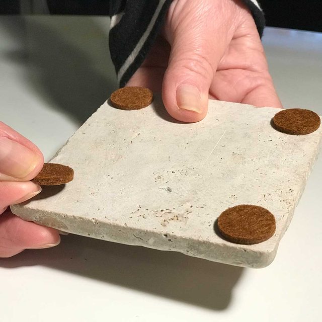 attach stick pads on tile