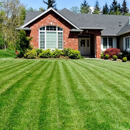 Ranch Style home with a perfect lawn