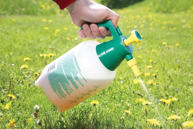 Spraying liquid on grass