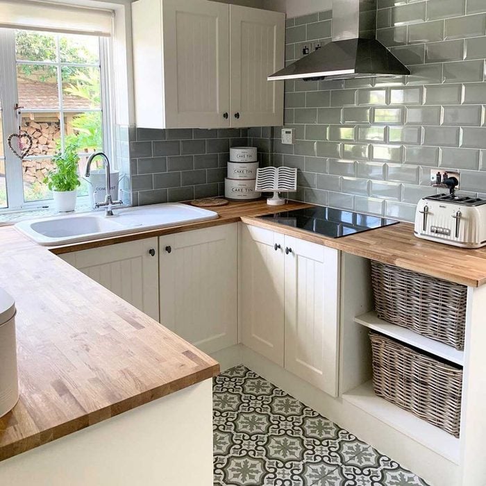 Kitchen with patterned floor tiles