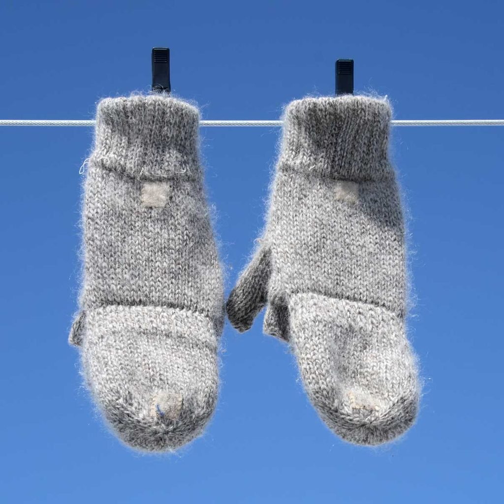 Mittens hanging on a clothesline