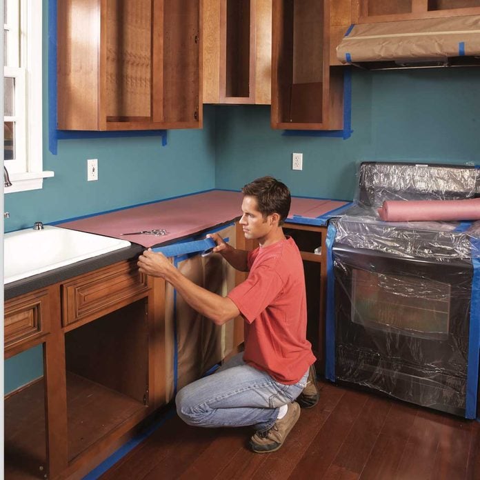How To Spray Paint Kitchen Cabinets Diy Family Handyman - How To Paint Walls Around Kitchen Cabinets