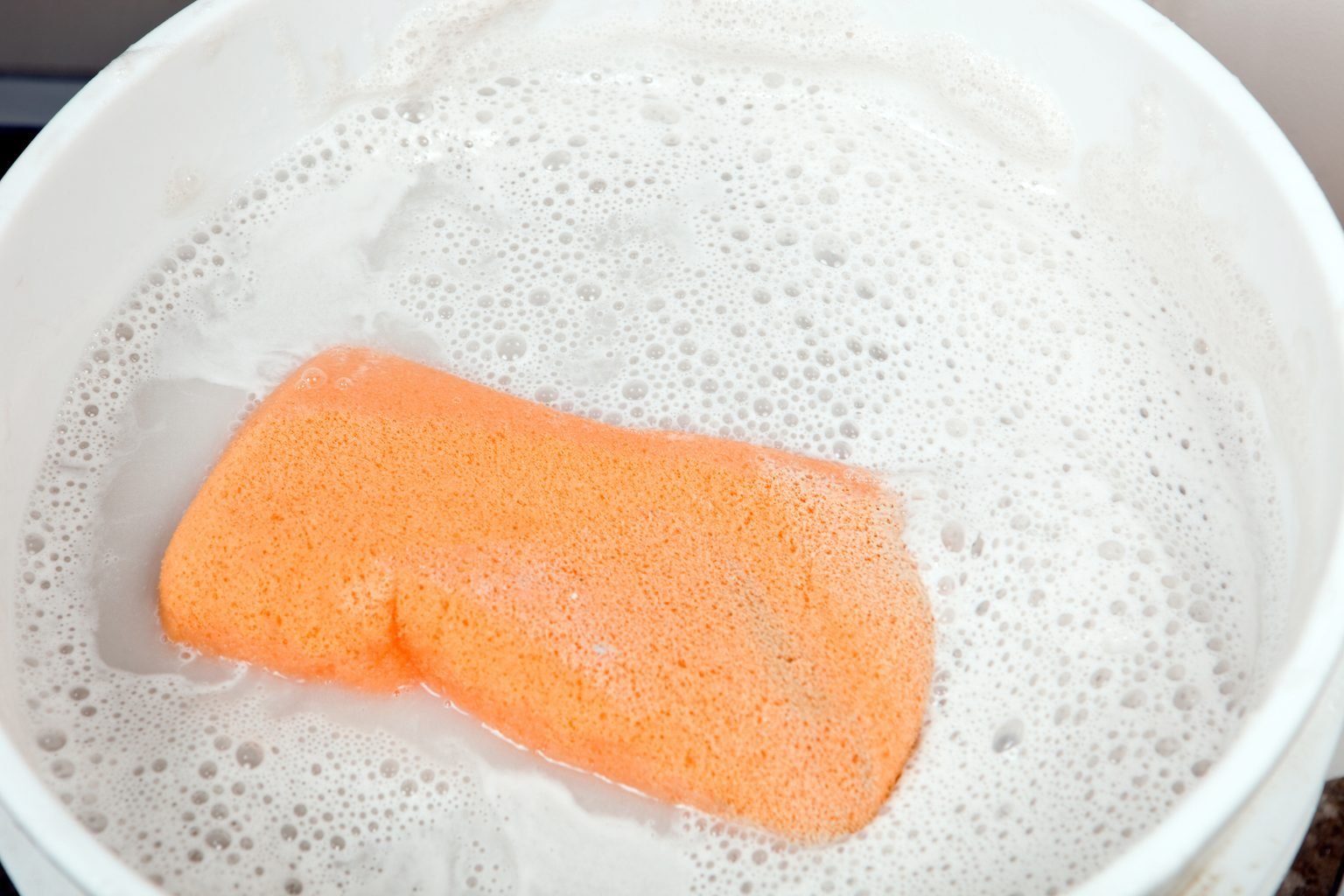 Sponge In A Bucket Of Dirty Sudsy Water