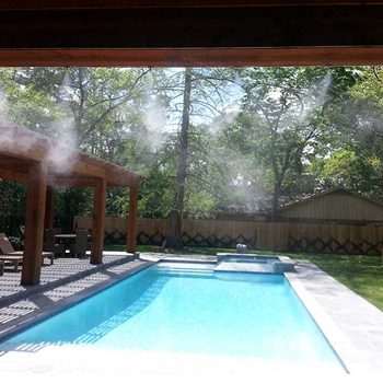 Outdoor Misting System by pool in backyard