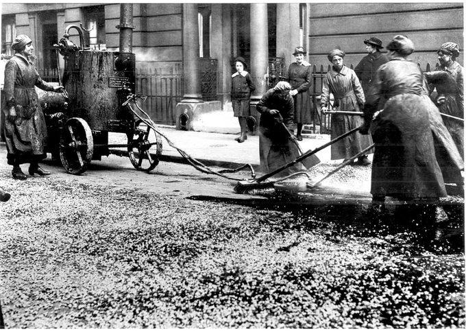 World War I - 1914 - 1918. After conscription in 1916, British women took over many civilian jobs. Women resurfacing a city street in Westminster, London.