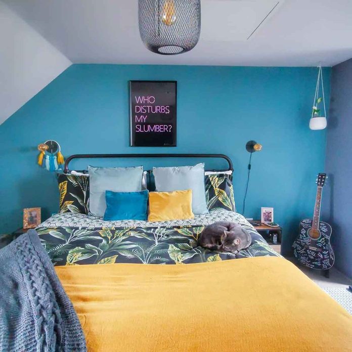 attic bedroom teal wall colorful