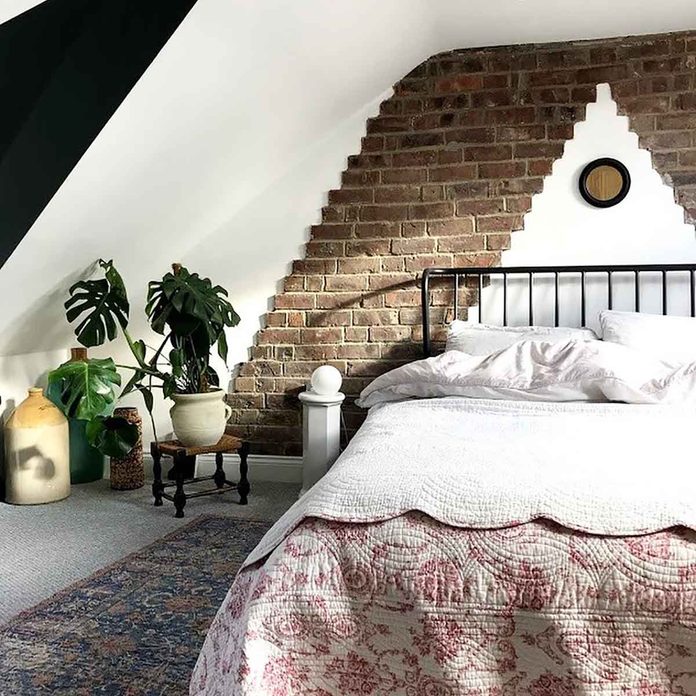 attic bedroom brick wall