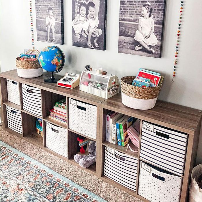 kid-friendly shelving with toys and kid activities for the play room