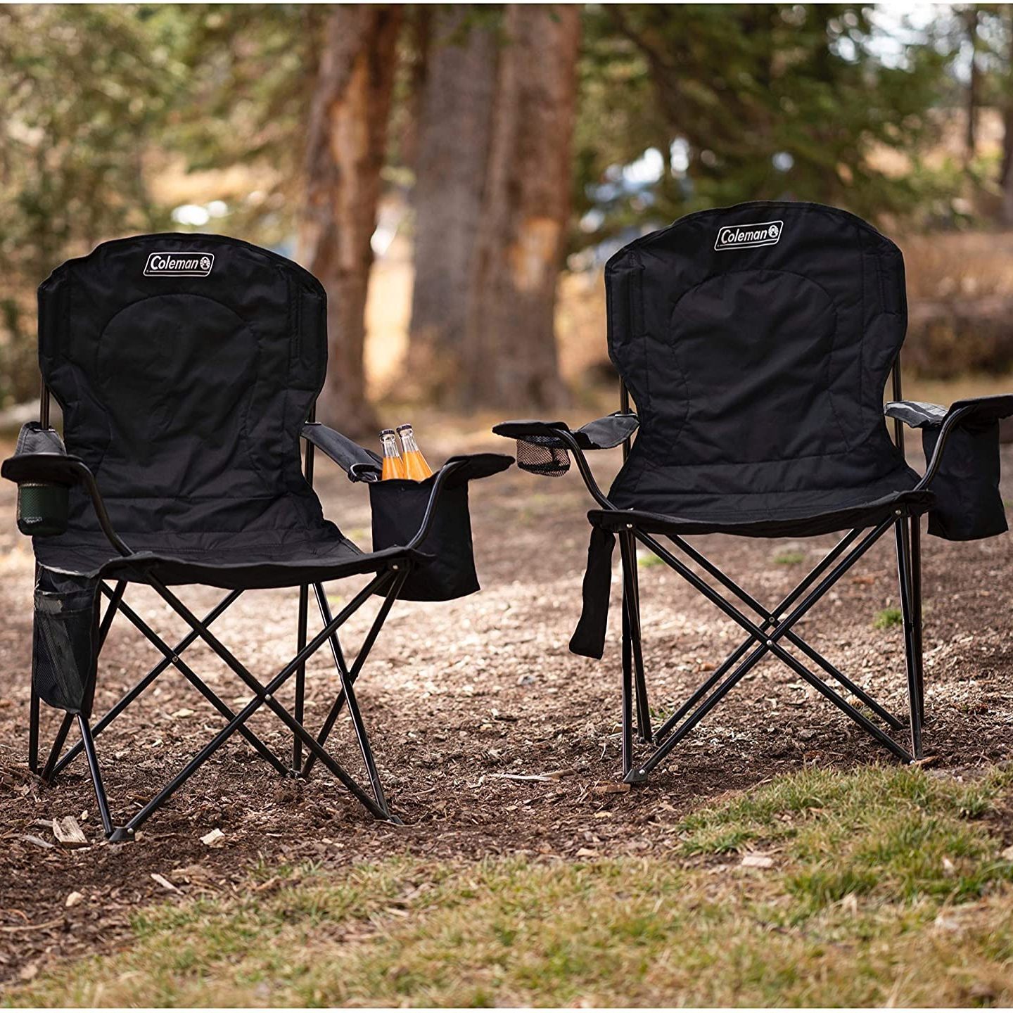 two coleman camping chairs in the woods