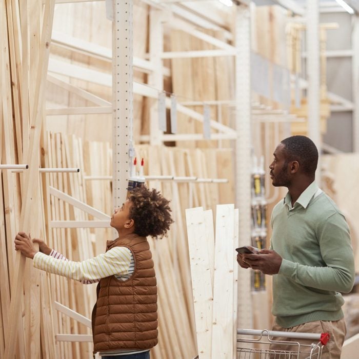 Father and Son Buying lumber in store