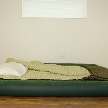 Blow up air mattress bed with sleeping bag and pillow