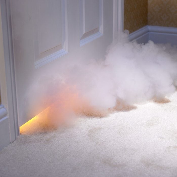 Smoke coming in under door in home