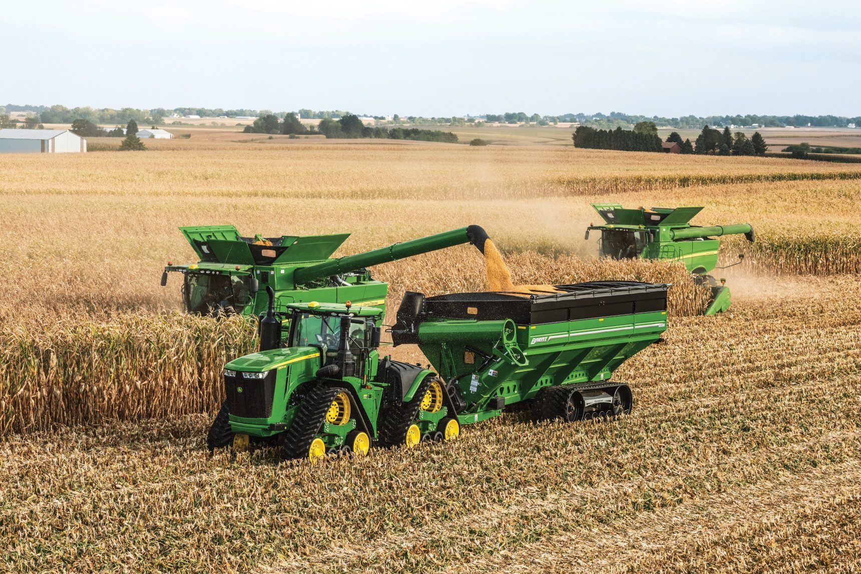 John Deere farm equipment in a corn field