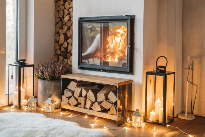 wood burning in fireplace to heat a home in the winter