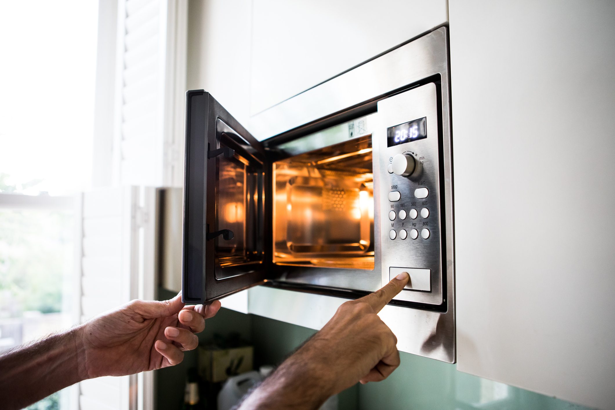 close up of using a microwave at home