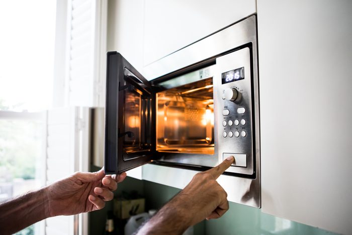 close up of using a microwave at home