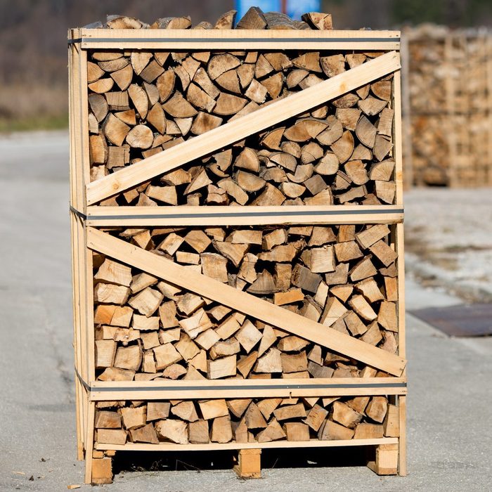 Wood pallet filled with firewood. Firewood ready for the winter season