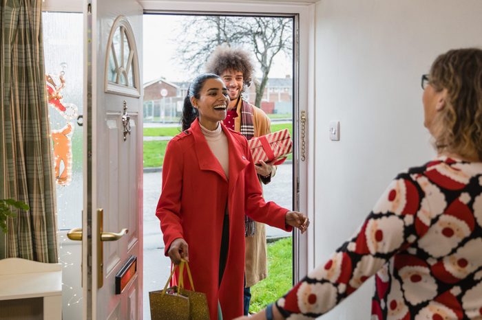 holiday guests walking into the house