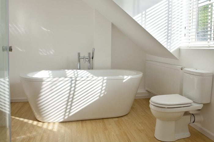 Modern white bathroom with toilet and sink