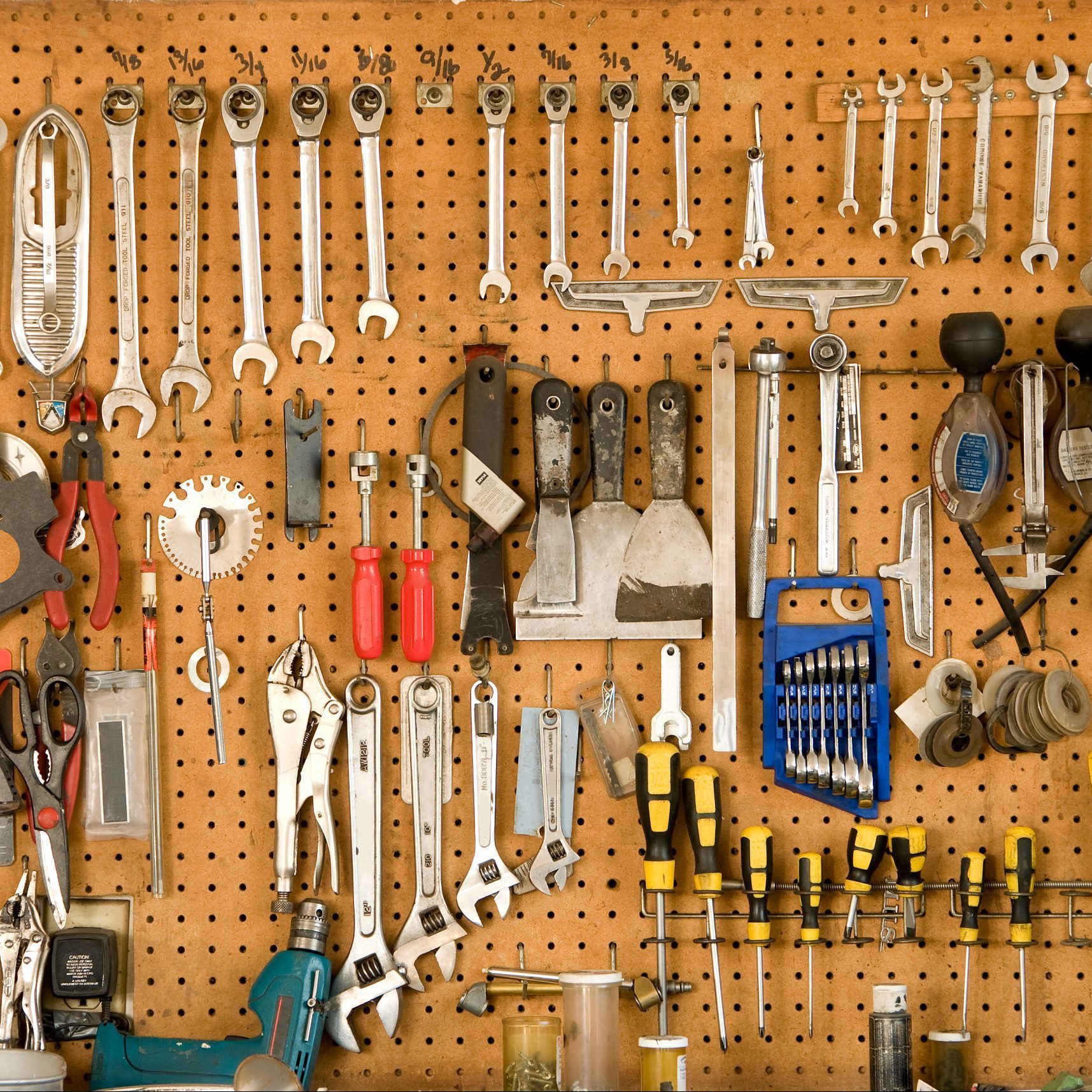 tools hanging on pegboard in garage