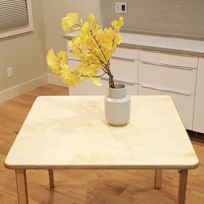 handmade Folding Table with a vase a flowers