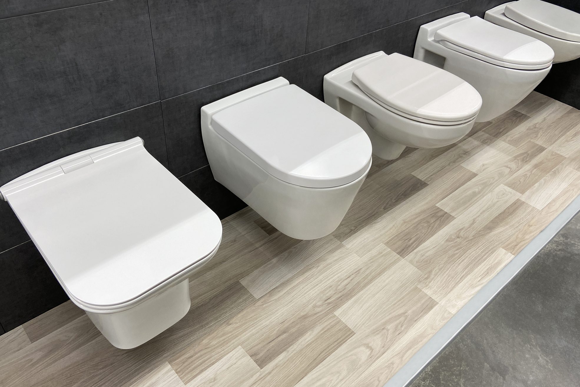 White Toilets lined up In a Showroom