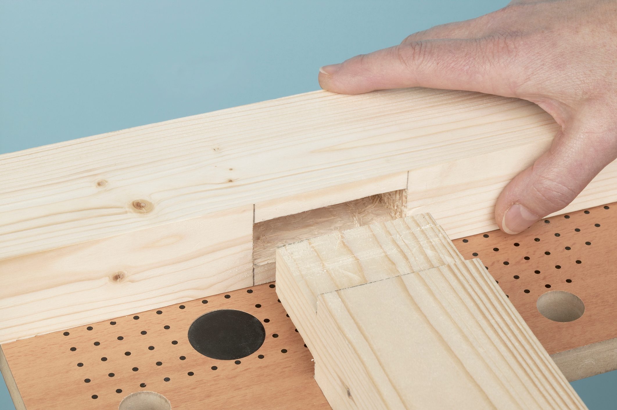 Person joining together a mortise and tenon joint