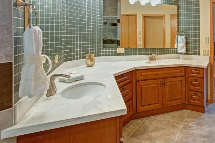 Stunning bathroom with a double vanity with marble top.