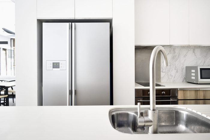 modern kitchen with stainless steel refrigerator