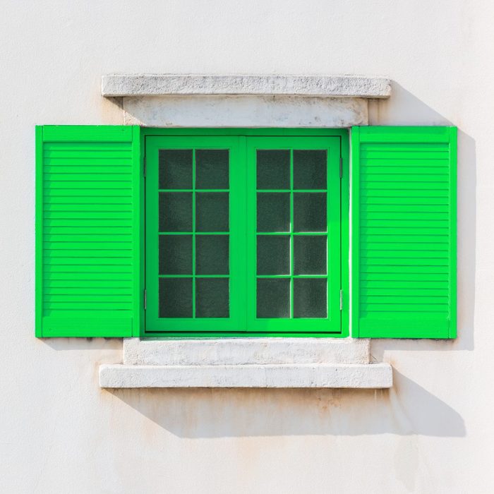 Colorful Green Window frame on exterior of house