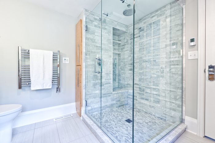 modern luxury shower in white marble bathroom