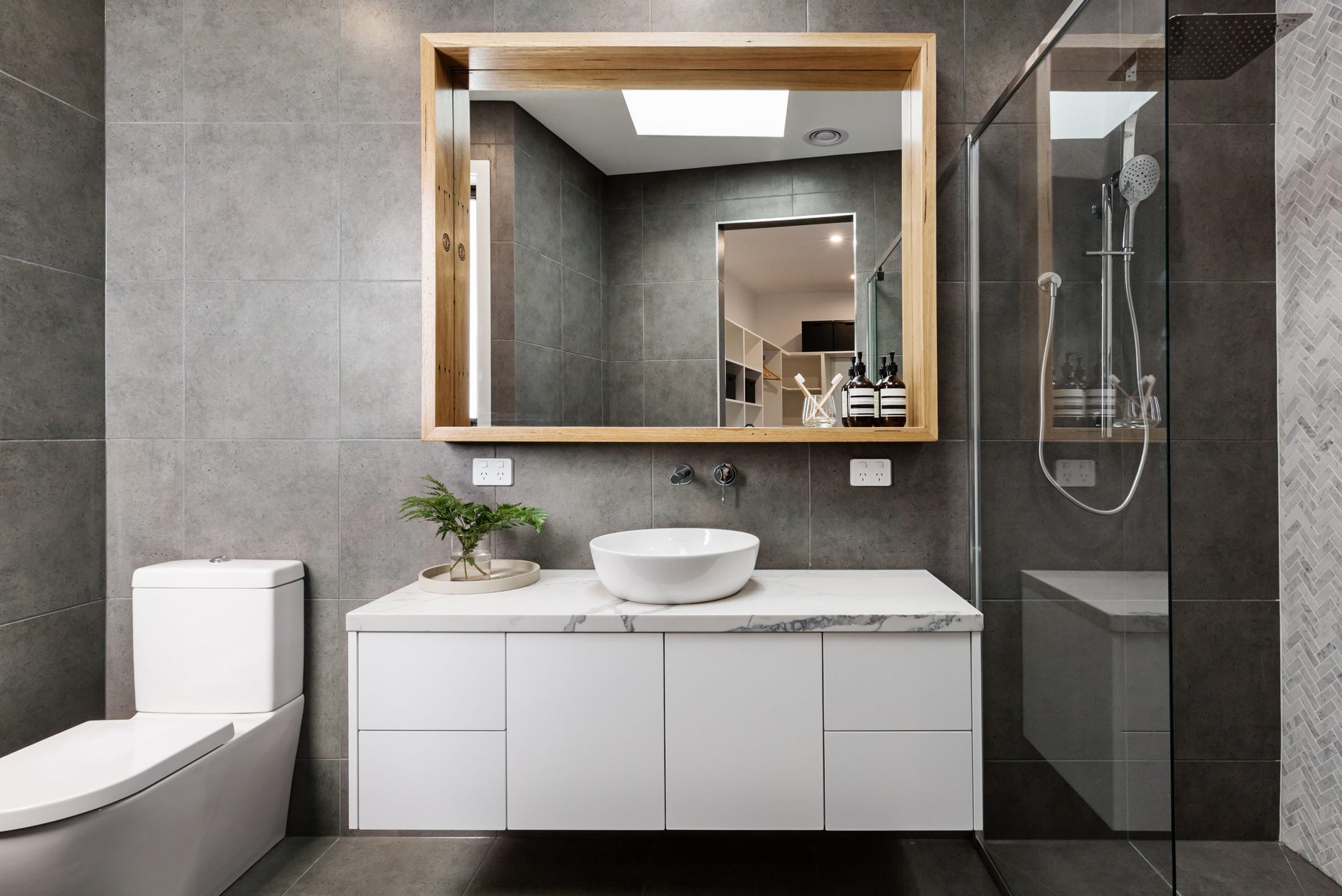Modern grey bathroom with wall mounted floating vanity