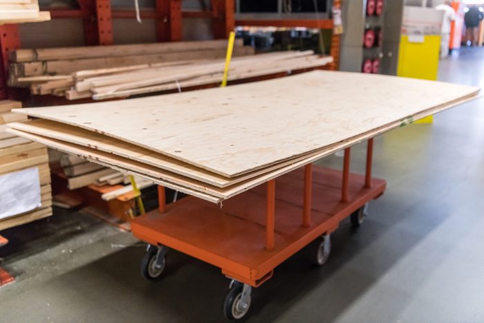 Plywood on a cart in a home improvement hardware store