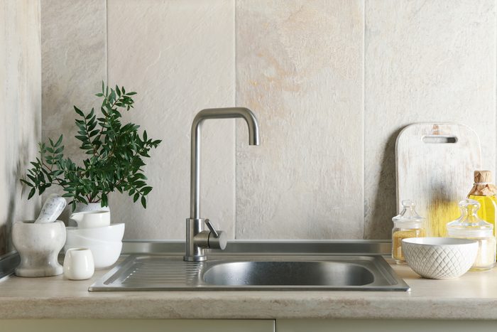 Kitchen interior with sink and different supplies