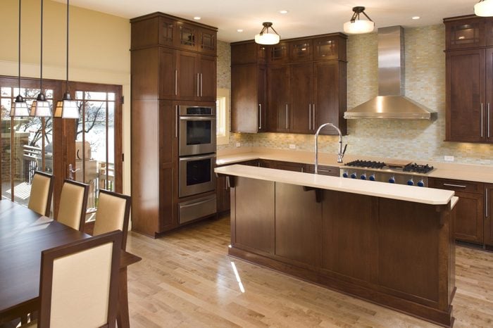 Modern residential kitchen with maple and stainless.
