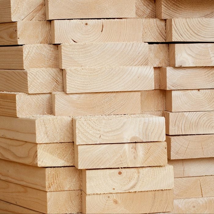 Stack of wooden planks inside workshop