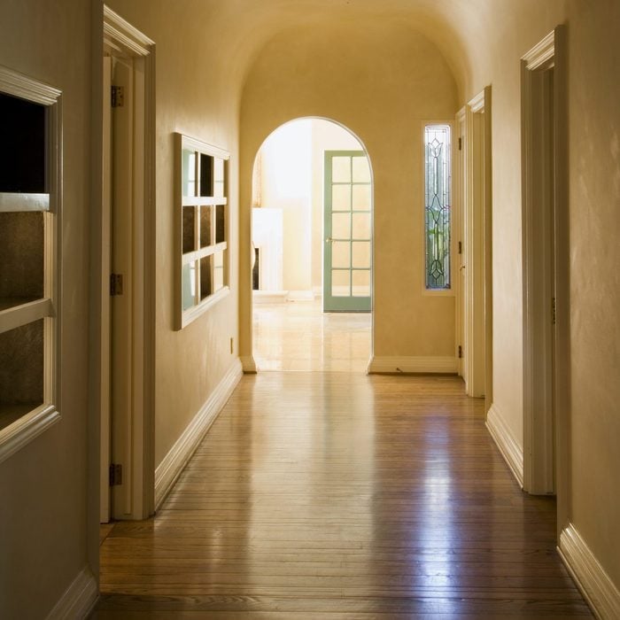 Long Arched Hallway with Many Doors