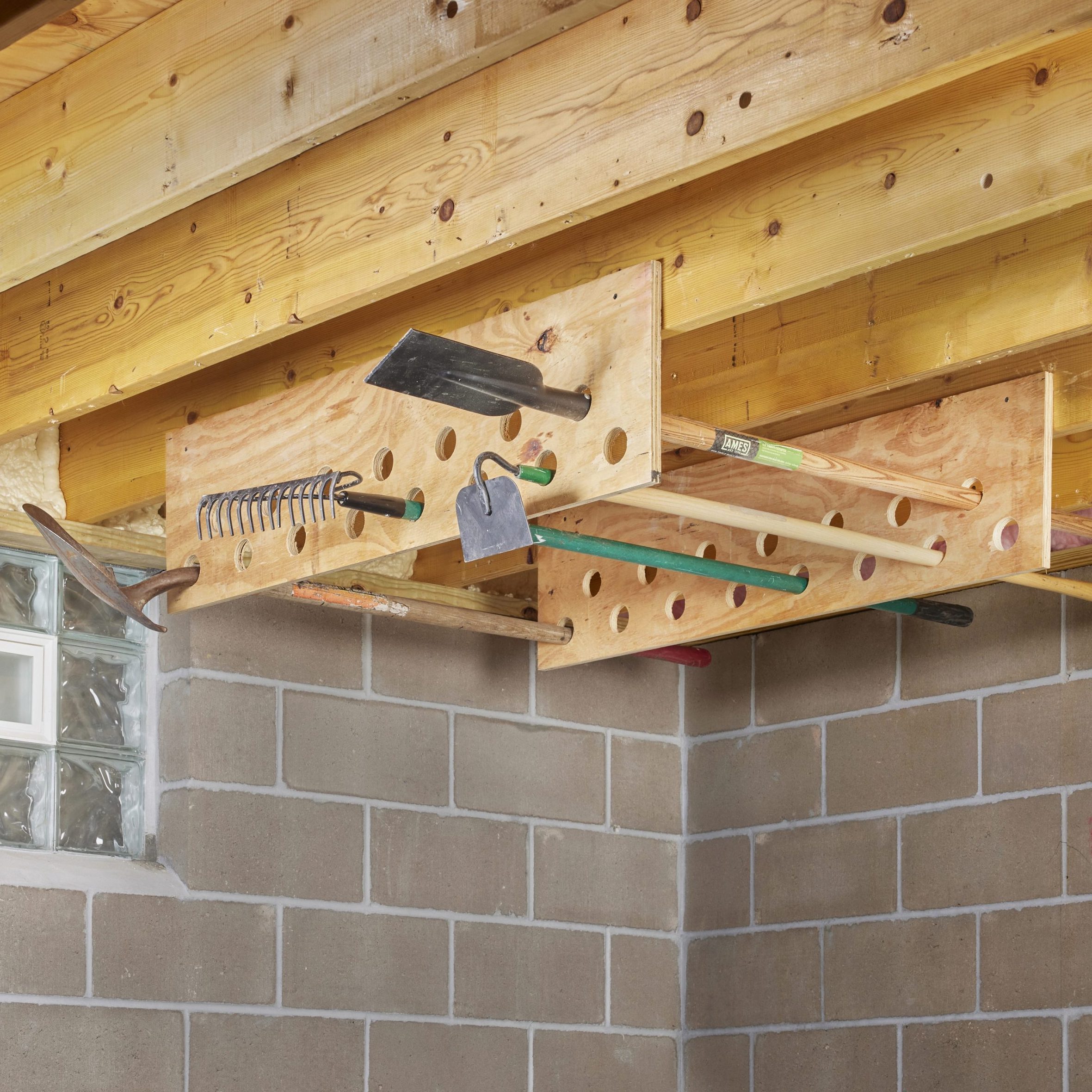 garage tool organizer hanging from ceiling planks