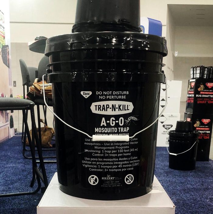 A black bucket labeled Trap N Kill Mosquito Trap at the National Hardware Show